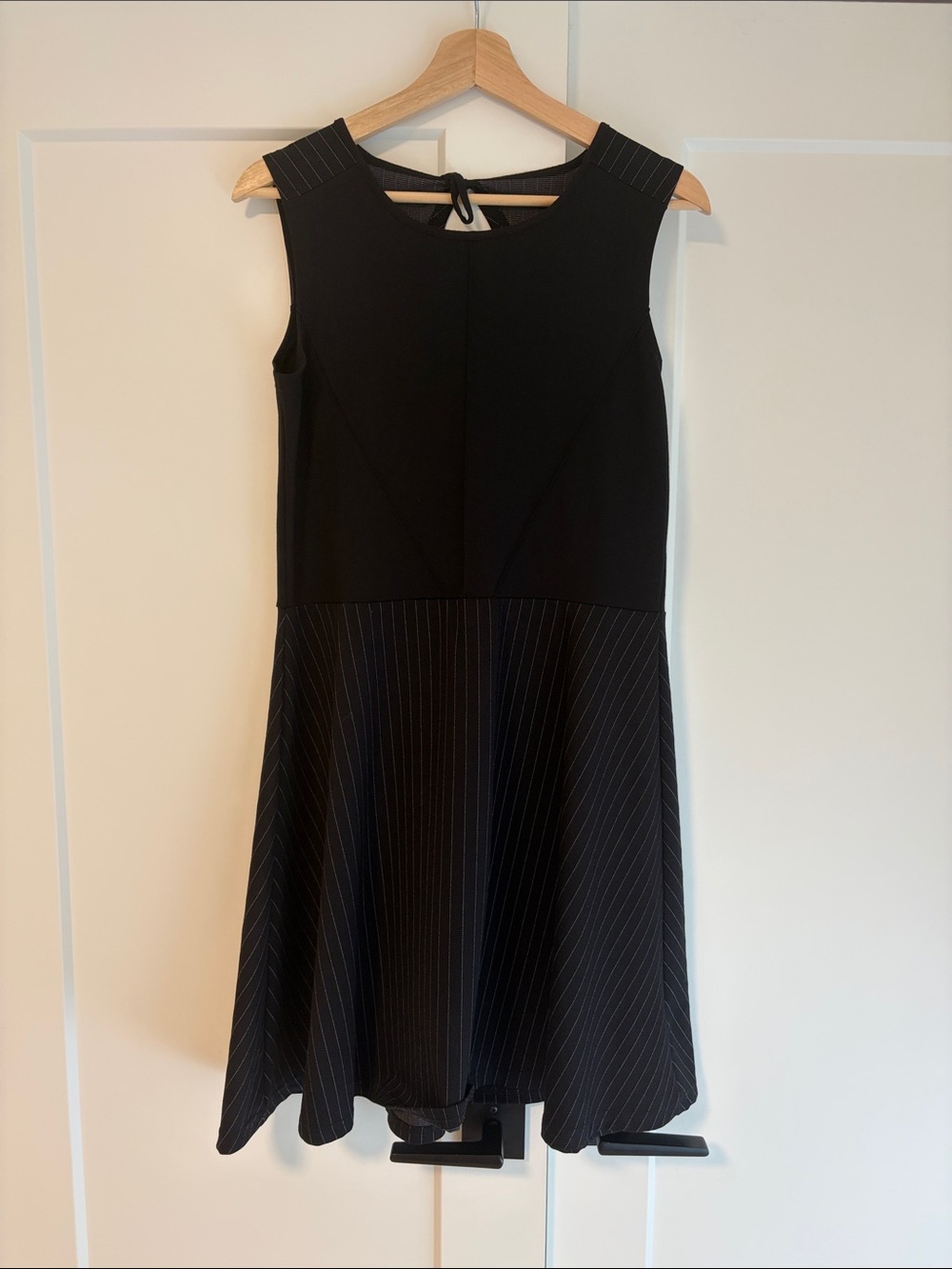 Women's Black Sleeveless Midi Dress with Subtle Pinstripe Skirt